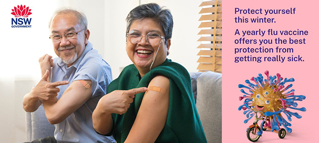 two older people pointing out their flu vaccinations