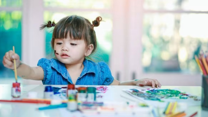 young girl painting